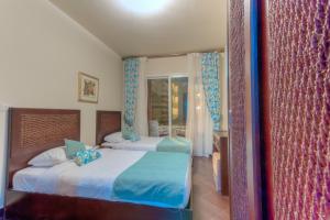 Postel nebo postele na pokoji v ubytování Porto Matrouh Apartments powered By Amer-Group