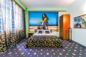 a hotel room with a bed and a large window at Apartment & Guest Rooms ART Bukhta in Sevastopol