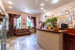 a lobby with a bar and a waiting room at Elizar Hotel in Saint Petersburg