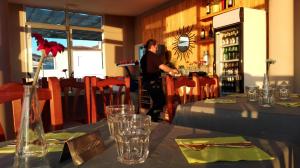 a woman standing at a bar in a restaurant at Apartamento el Benicadell in Adzaneta de Albaida +46 photos