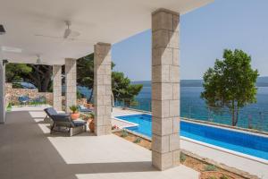 a villa with a view of the ocean at Absolute Beach Villa in Omiš