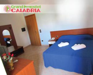 Posteľ alebo postele v izbe v ubytovaní Grand Hostel Calabria
