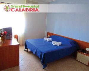 Posteľ alebo postele v izbe v ubytovaní Grand Hostel Calabria
