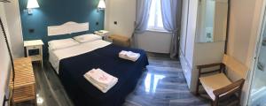 A bed or beds in a room at B&B Ponza Suite