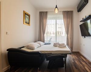 Postel nebo postele na pokoji v ubytování Apartment Zeus Znjan Split