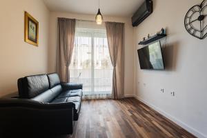 Televízia a/alebo spoločenská miestnosť v ubytovaní Apartment Zeus Znjan Split