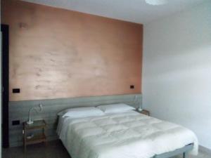 a bedroom with a large bed in a room at Osteria dell'Americano in Potenza