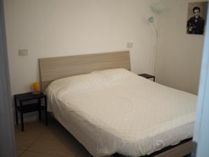 Lova arba lovos apgyvendinimo įstaigoje Appartamento in Centro Storico, vicino alla Stazione e al Mare