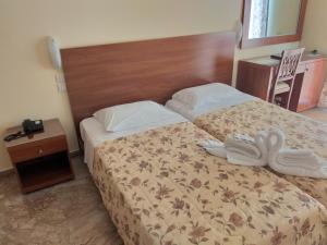 Postel nebo postele na pokoji v ubytování Sofia Hotel