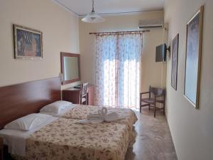 Ένα ή περισσότερα κρεβάτια σε δωμάτιο στο Sofia Hotel