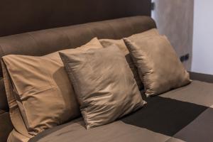 a group of pillows sitting on a couch at SUITE 11 NEAR DUOMO in Milan