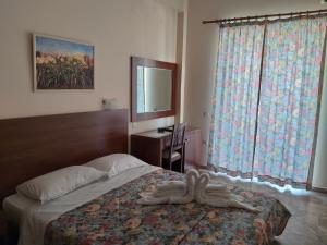 Postel nebo postele na pokoji v ubytování Sofia Hotel