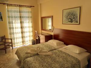 Postel nebo postele na pokoji v ubytování Sofia Hotel