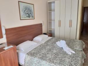 Postel nebo postele na pokoji v ubytování Sofia Hotel