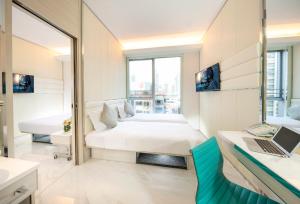 Ένα ή περισσότερα κρεβάτια σε δωμάτιο στο iclub Mong Kok Hotel