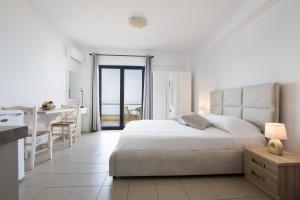 Posteľ alebo postele v izbe v ubytovaní Kimata Apartments