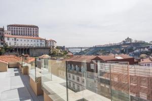 a large building with a view of the city at The Editory House Ribeira Porto Hotel in Porto