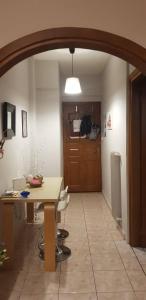 a room with a table and chairs and a door at •Budget travellers •Great location in Athens