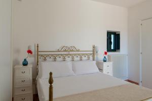 Posteľ alebo postele v izbe v ubytovaní Stile e relax nei trulli by Wonderful Italy