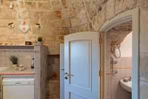Kúpeľňa v ubytovaní Stile e relax nei trulli by Wonderful Italy + 30 fotografií