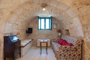 Televízia a/alebo spoločenská miestnosť v ubytovaní Stile e relax nei trulli by Wonderful Italy