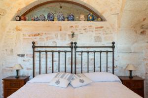 Posteľ alebo postele v izbe v ubytovaní Stile e relax nei trulli by Wonderful Italy