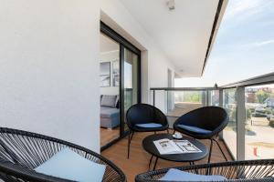 Część wypoczynkowa w obiekcie Apartamenty Gardenia Seaside by Noclegi Renters