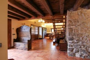 an old stove in a room with a stone wall at El Porxo de Mateus in Sagás +24 photos
