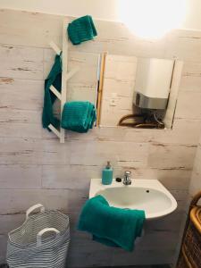 a bathroom with a sink and a mirror at Little Greece in Balatonfüred