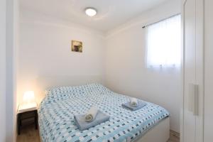Postel nebo postele na pokoji v ubytování Seaside apartments