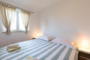Postel nebo postele na pokoji v ubytování Seaside apartments