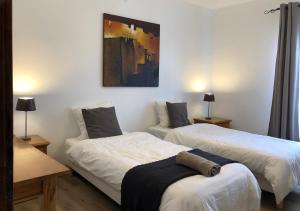 En eller flere senge i et værelse på Gîte 90m2, grande terrasse, 3 chambres Mondelange