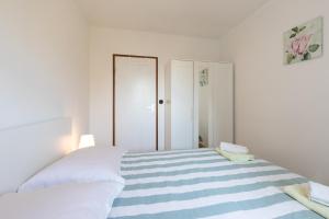 Postel nebo postele na pokoji v ubytování Seaside apartments