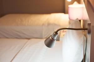 Postel nebo postele na pokoji v ubytování Lilac Relax-Residence