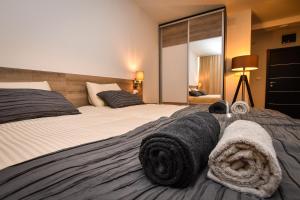 Postel nebo postele na pokoji v ubytování Miido Apartments