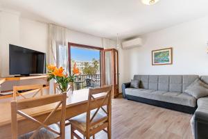 a living room with a couch and a table at Apartment Llevant in Alcudia