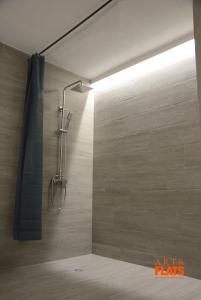 a shower with a shower head in a bathroom at Art&Flats Hostel in Valencia