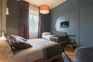 Postel nebo postele na pokoji v ubytování Le Texture Premium Rooms Duomo-Cordusio