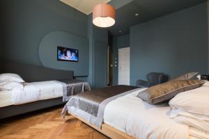 Postel nebo postele na pokoji v ubytování Le Texture Premium Rooms Duomo-Cordusio