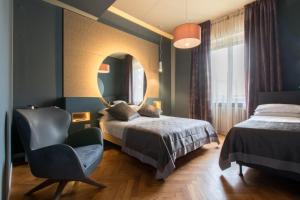 Postel nebo postele na pokoji v ubytování Le Texture Premium Rooms Duomo-Cordusio