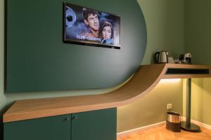 TV a/nebo společenská místnost v ubytování Le Texture Premium Rooms Duomo-Cordusio