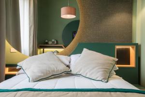 Postel nebo postele na pokoji v ubytování Le Texture Premium Rooms Duomo-Cordusio