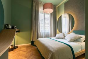 Postel nebo postele na pokoji v ubytování Le Texture Premium Rooms Duomo-Cordusio
