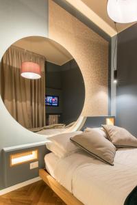 Postel nebo postele na pokoji v ubytování Le Texture Premium Rooms Duomo-Cordusio