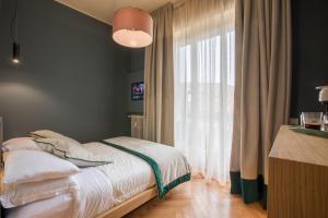 Postel nebo postele na pokoji v ubytování Le Texture Premium Rooms Duomo-Cordusio