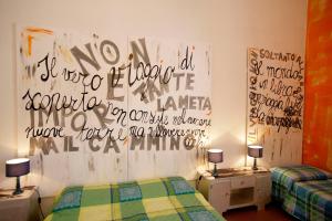 Posteľ alebo postele v izbe v ubytovaní B&B Le Lupe