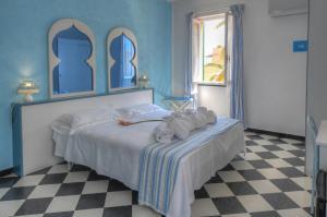 Posteľ alebo postele v izbe v ubytovaní Hotel Arabesque