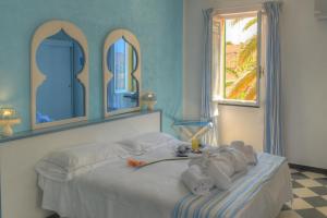Posteľ alebo postele v izbe v ubytovaní Hotel Arabesque
