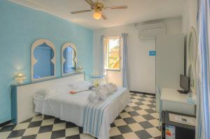 Posteľ alebo postele v izbe v ubytovaní Hotel Arabesque