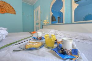 Posteľ alebo postele v izbe v ubytovaní Hotel Arabesque
